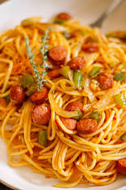 Haitian spaghetti with sausage, peppers, and onions